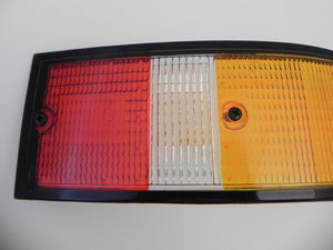 (New) 911/912/930 Genuine Right Side Euro Amber/Red/Clear Tail Light Lens with Black Trim - 1973-89