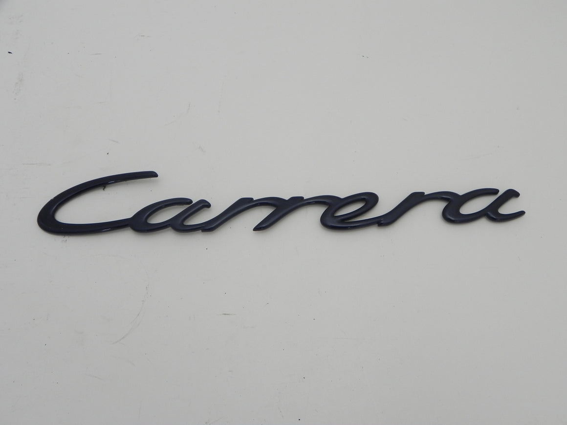 (Used) Original 996 Blue Metallic "Carrera" Engine Lid Emblem - 1999-2004