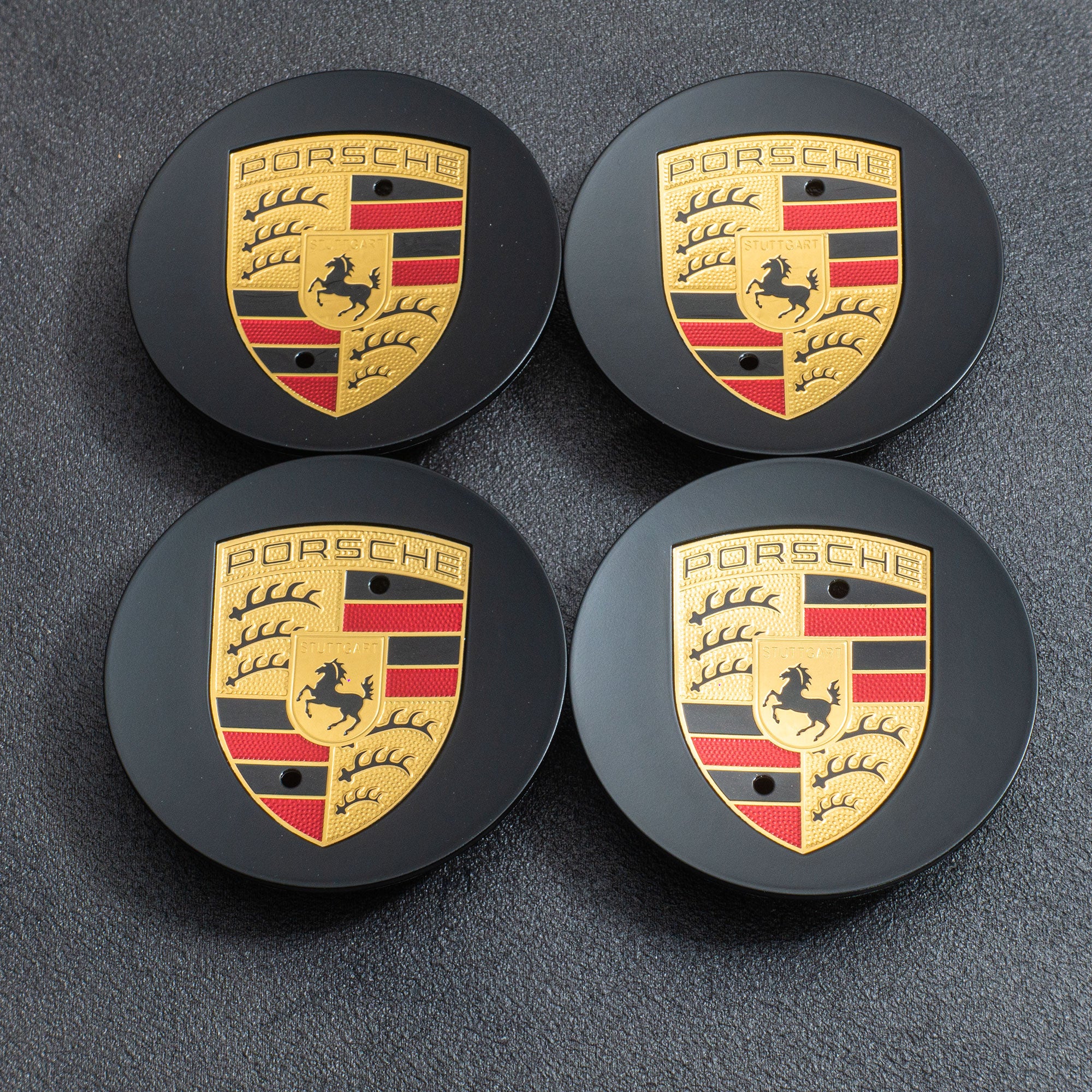 New) 718 Cayman GT4/Spyder Black Colored Crest Hubcap Set