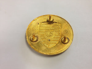 (NOS) 356/911/912 Gold Enamel Hubcap Crest with Late Style Red Bars  - 1950-76