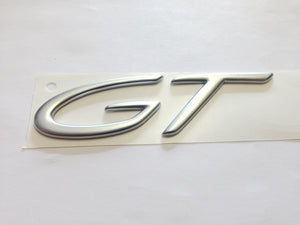 (New) Silver " GT " Emblem - 2004-06