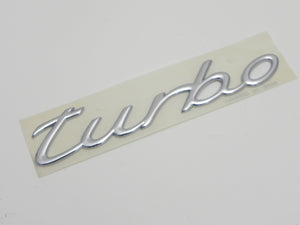 (NOS) 996/997 Chrome "Turbo" Script Emblem - 1999-2012