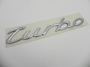(NOS) 996/997 Chrome "Turbo" Script Emblem - 1999-2012