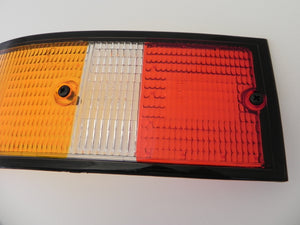 (New) 911/912/930 Genuine Left Side Euro Amber/Red/Clear Tail Light Lens with Black Trim - 1973-89