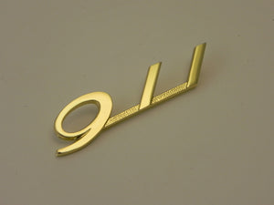 (New) Gold 911 Glove Box Emblem - 1965-66